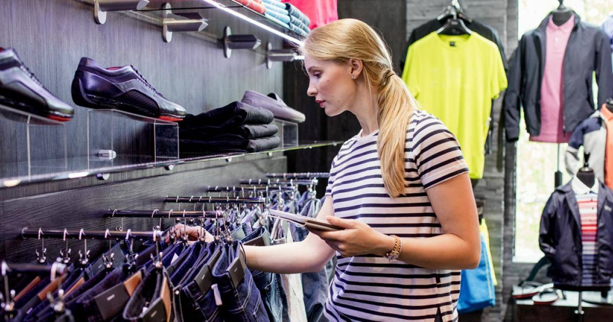 Shopper in a store looking at footwear