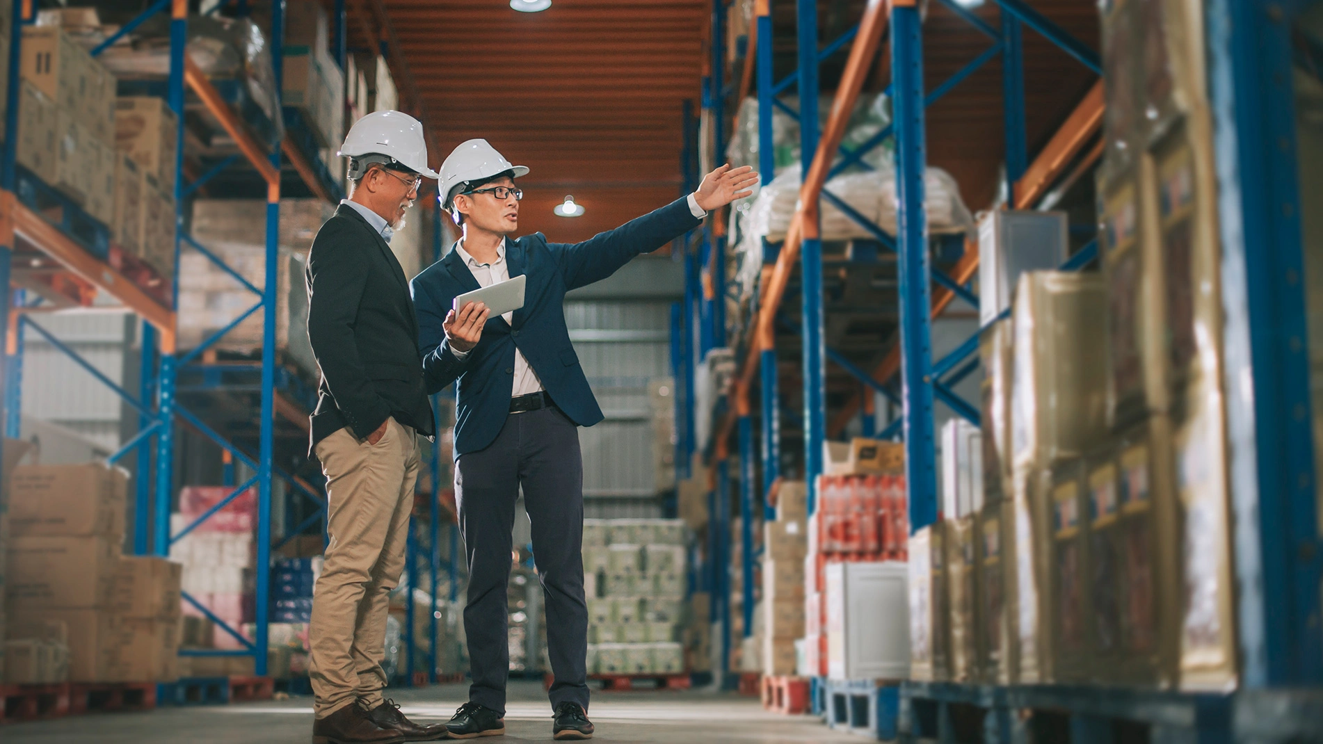 Managers in a distribution center looking at inventory